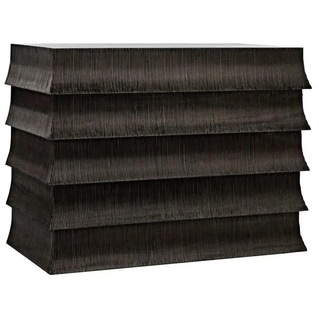 Ruffled carvings inspired by the dresses worn by flappers in the 1930s elevate the 5-drawer Eva dresser far above the...
