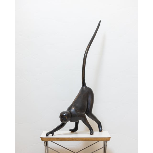 A striking large-scale modernist monkey sculpture, cast in solid bronze and defined by its elongated limbs and dynamic,...