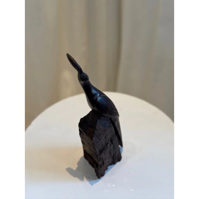 This exquisite hand-carved ironwood pheasant sculpture showcases masterful craftsmanship with detailed feather etchings...