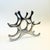 A vintage aluminum table top wine rack designed by Michael Noll. Great sculptural shape that can hold up to 6 bottles....