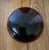 Handmade amber glass apothecary-style jar with a rounded, dome-shaped glass lid. There's a dark rubber or plastic seal...