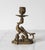 Vintage Victorian-style brass griffin candlestick holder. It features an ornate mythological creature with a curled tail...