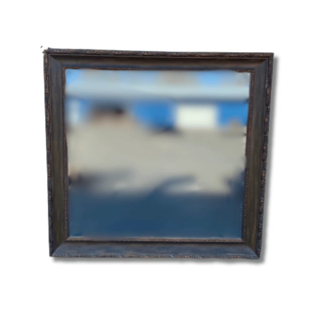 This large wood mirror is framed in rich brown tones with a carved edge. Good condition. From 1990’s. This is The size...