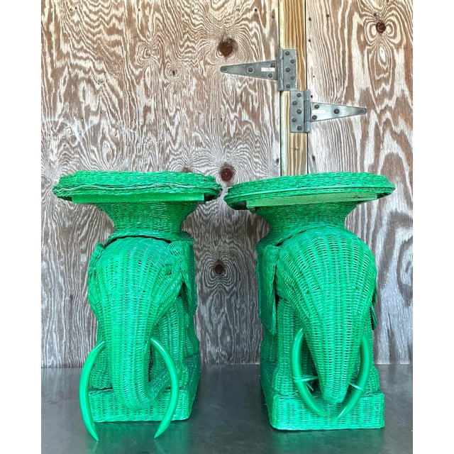 Celebrate coastal charm and playful craftsmanship with this whimsical pair of vintage woven rattan elephant side tables....