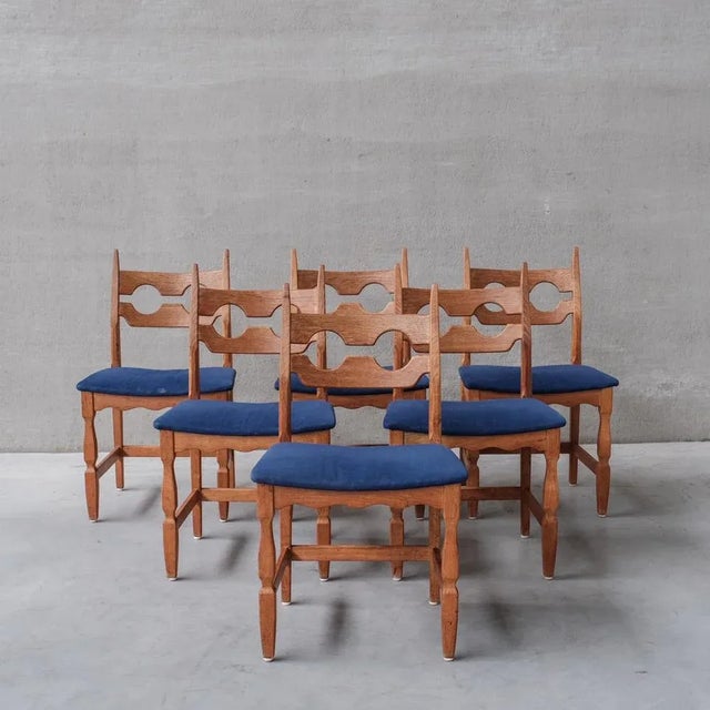 Oak dining chairs by Henning/Henry Kjaernulf. Denmark, 1960s. 'Razor back' or 'Razor blade' model. A more rare model with...