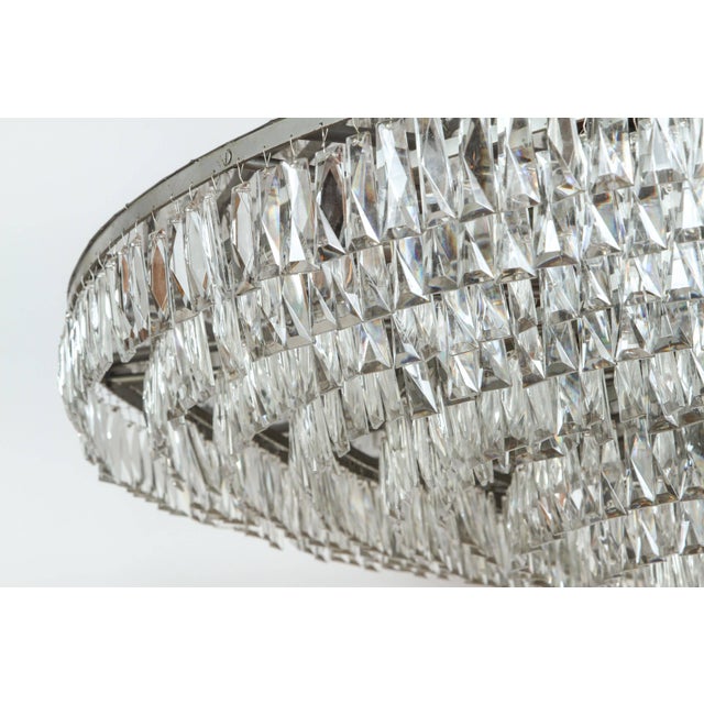 Aluminum and chrome chandelier Has 1308 crystals and 31 sockets. They are originally from the ballroom of an apartment...