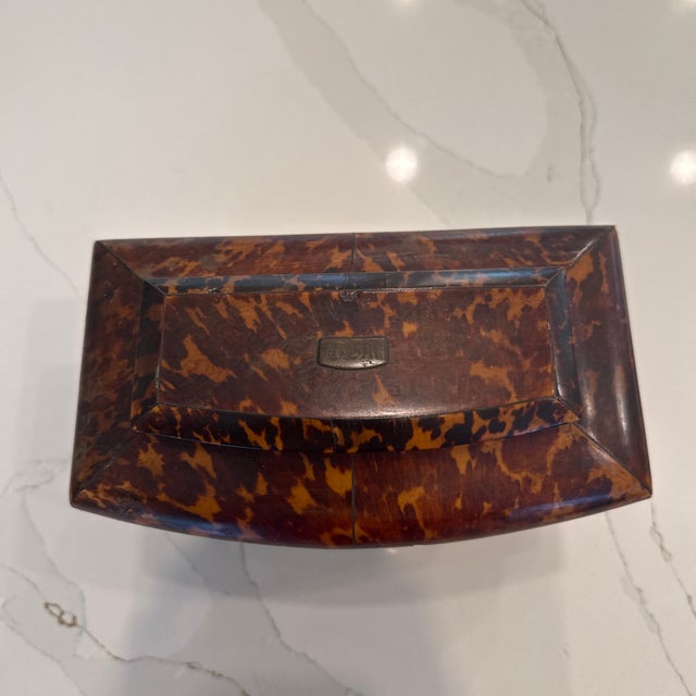 English faux tortoise tea caddy. It also has its original copper insert. I acquired at 25 years ago from a Palm Beach estate.