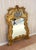 1960s-70s large ornate giltwood-frame wall mirror. Excellent condition. Measures 49" x 31.5" including frame.