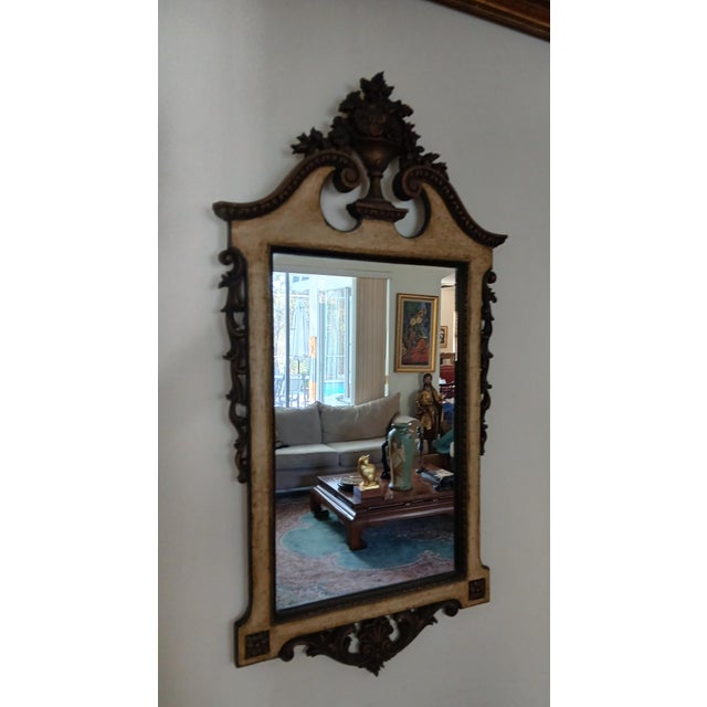 Here's an accessory to add some real old-world style to your home. Made of carved wood and with a bronze and antique white...