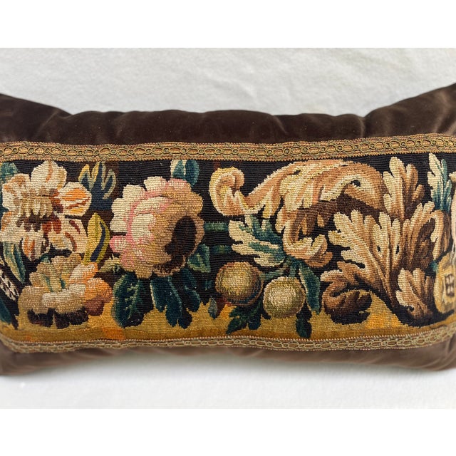 This decorative pillow is upholstered with an authentic 18th-century tapestry, showcasing 2 beautifully detailed birds...
