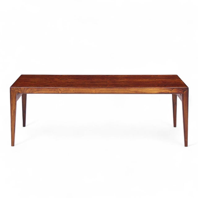Johannes Andersen Mid Century Danish Rosewood Hidden Leaf Coffee Table This table measures: 59 wide x 23.5 deep x 20 high,...