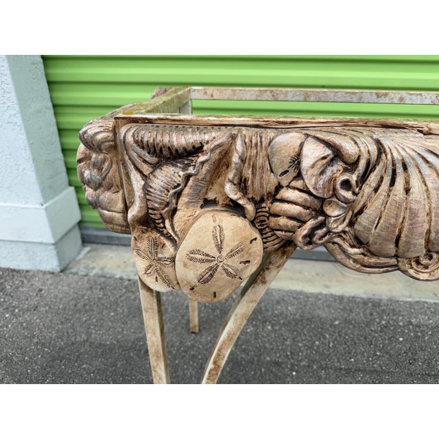 A striking vintage sculptural shell console table, designed in the style of Mid-Century Italian decorative furniture. The...