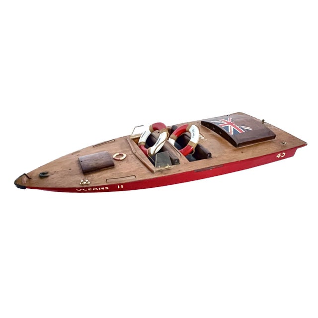 Vintage British Kiel Kraft model motorboat with removable motor compartment cover. Cover has British flag decal. Model...