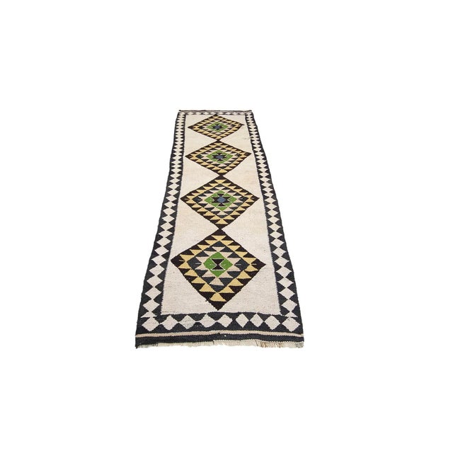 Vintage handwoven decorative kilim runner from Northern Iraq. Approximately 40-50 years old. In very good condition.