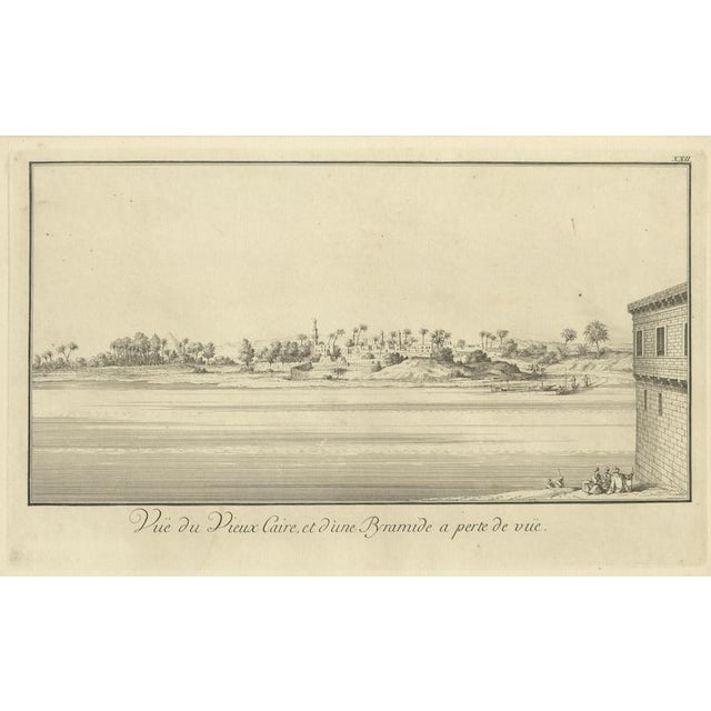 Old Cairo on the Nile with Distant Pyramids – Antique Egypt Engraving, c.1755 This elegant 18th-century copper engraving...