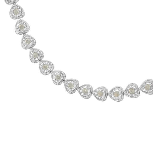 This gorgeous .925 sterling silver tennis bracelet features 1.0 carat total weight with 40 round, rose cut diamonds. The...