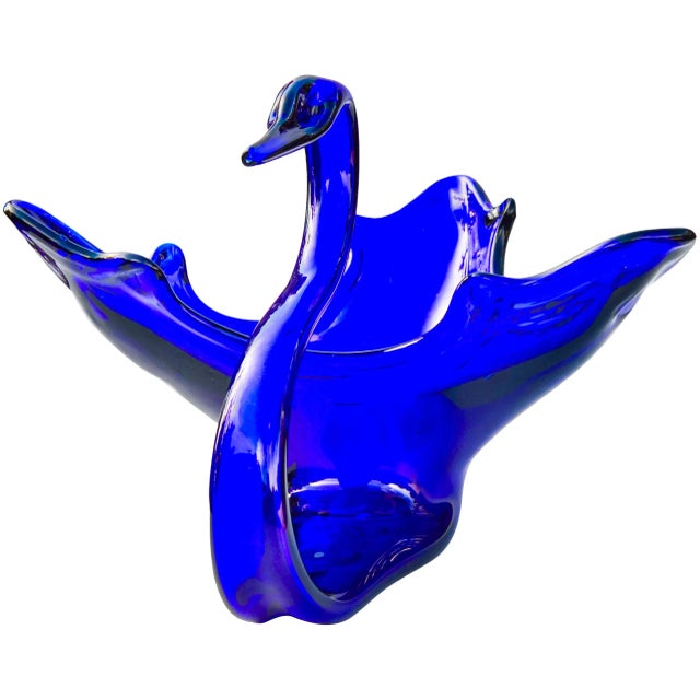 We love how this exquisite midcentury cobalt blue glass-art swan centerpiece works with all types of breezy coastal decor...