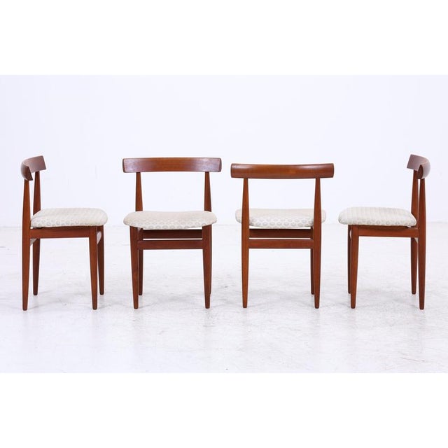 Set of four Roundette chairs by Hans Olsen for Frem Røjle. The distinctive backrest, the boldly rounded edges, and the...