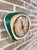 Vintage PANKRON wall clock with a retro design, featuring a distinctive contoured metal case with an enameled ceramic...