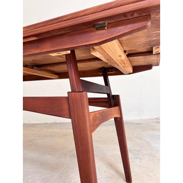 This Danish coffee table from the 1960s is a brilliant example of mid-century design versatility. At first glance, it...