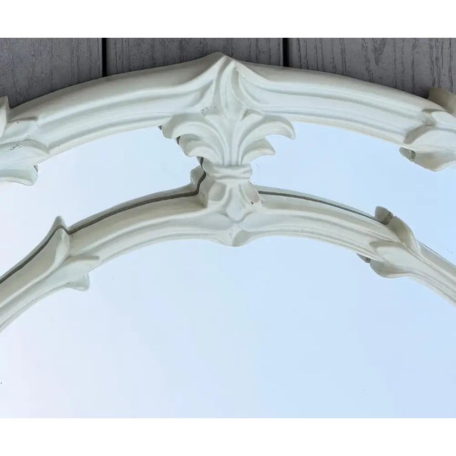 An exceptional and commanding Hollywood Regency arched wall mirror executed in the manner of iconic French designer Serge...