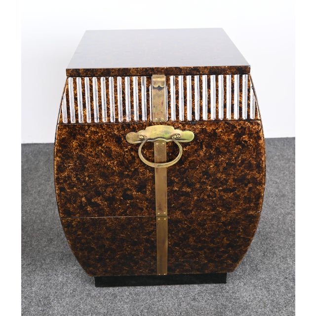 A prestigious pair of bombe end tables or side tables designed by Bert England for John Widdicomb. Originally designed for...