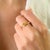 This luminous solitaire wave ring features 1 marquise cut yellow sapphire totaling 0.77 carats, set in solid 14K yellow...