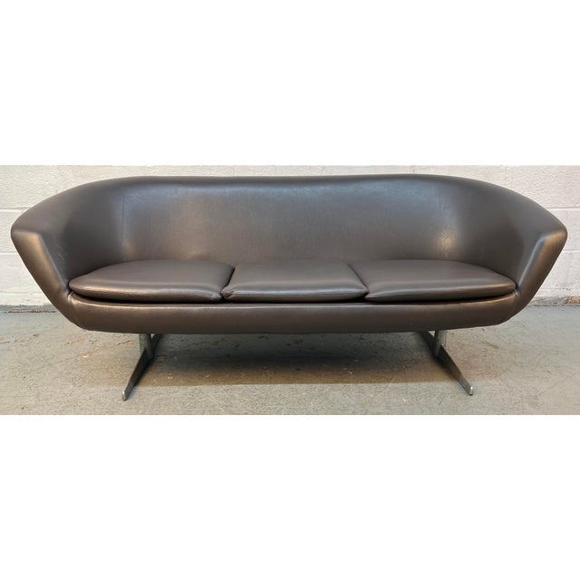 An iconic example of Scandinavian modern design, this rare 1960s "Pod" three-seater sofa was designed by Carl Eric Klote...