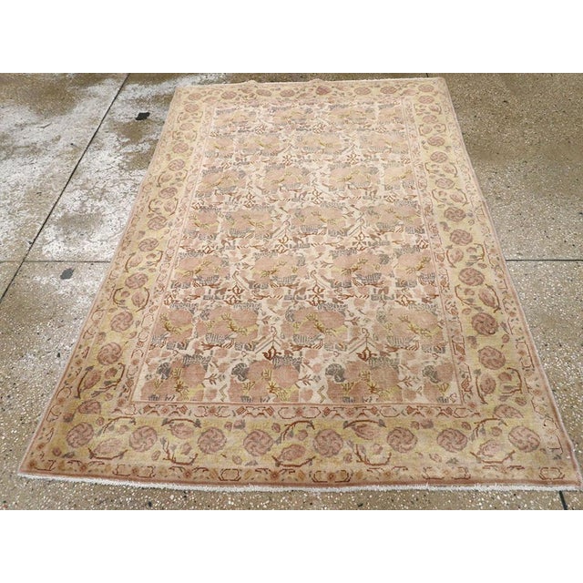 This Early 20th century Indian Lahore rug, measuring 4' 0" x 5' 11", is a striking example of the artistry and refinement...