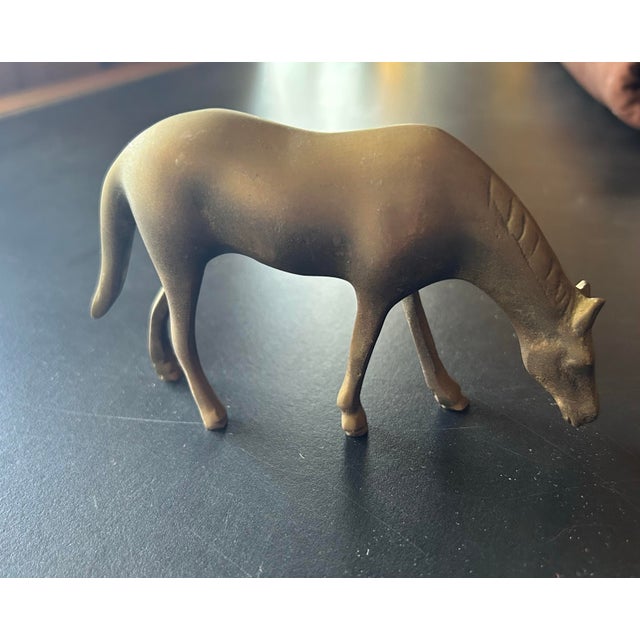 Vintage metal horse figurine. Brown patina. Matte finish.