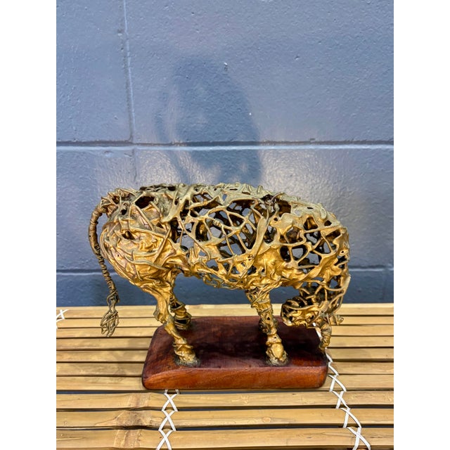 A highly sculptural mid-century modern bull, handmade in Spain and attributed to Manuel Revelles. The figure is...