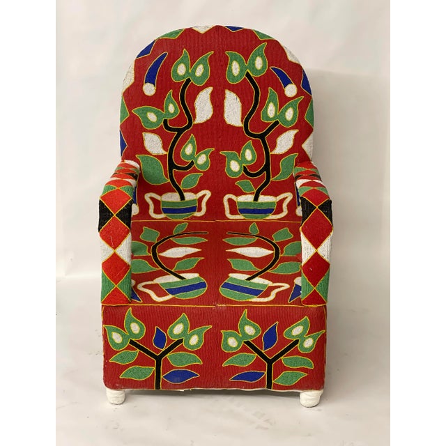 Handmade in Nigeria, these chairs are unique, all cover in beads. Seat height is 15". Measures 26" W x 23" D x 39" H with...