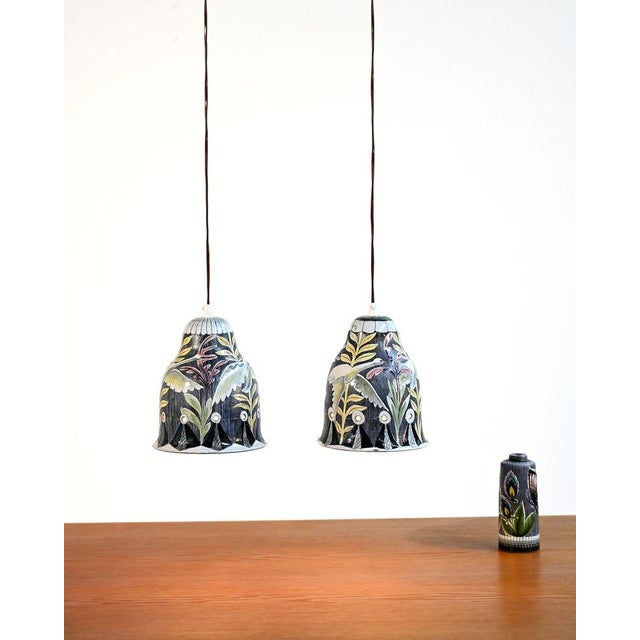 Glazed stoneware pendant lamps decorated with perforated polychrome floral motifs. Made by Tilgmans Keramik, Scandinavia,...