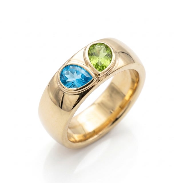 Make a bold, contemporary statement with this beautifully crafted Two-Stone Pear Cut Gemstone Ring. Designed in a modern,...