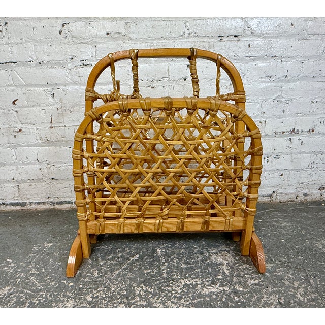 This magazine rack is made in the style of a snowshoe. This beautiful rack is in wonderful condition and ready to bring an...