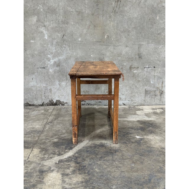 Charming late 19th century French provincial farm table featuring a beautifully worn patina and honest, time-earned...