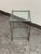 Design Plus Gallery presents a Contemporary Glass Top Side Table. A square clear glass panel rests above a slender metal...