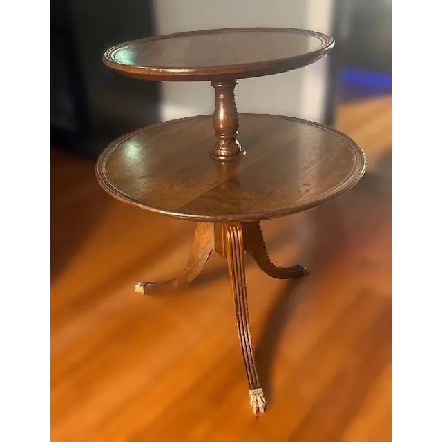Introducing the Vintage Dumbwaiter Table, a timeless piece of Mid Century Modern furniture. Crafted from Mahogany with a...