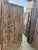A stunning vintage hand-carved wooden panel, originally crafted as a traditional Indian door, reimagined as a striking...