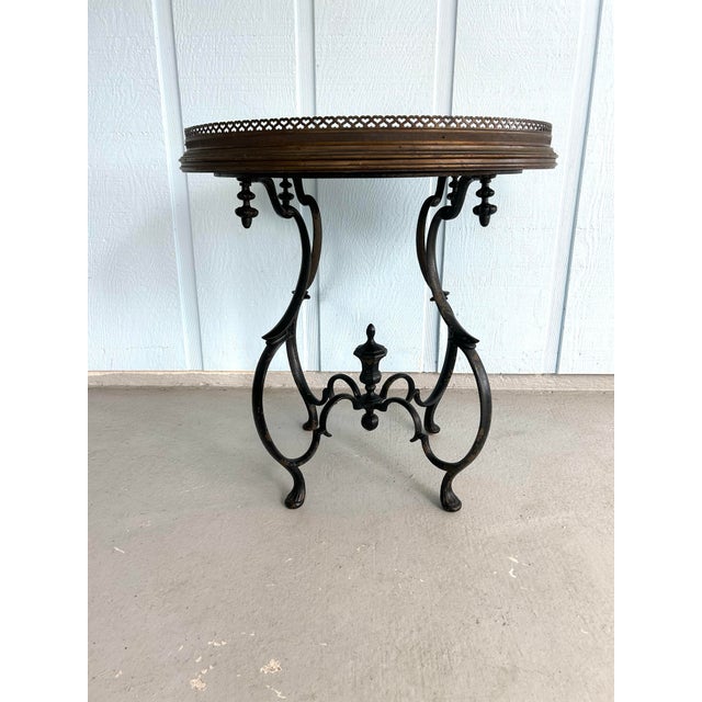 This is a rare and striking antique chinoiserie tray-top accent table, comprising a hand-decorated round wooden tray in...