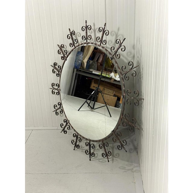 Very large round wrought iron wall mirror. 1960’s. In good condition, 1 mirror clamp is renewed. Diameter 120/82 cm.