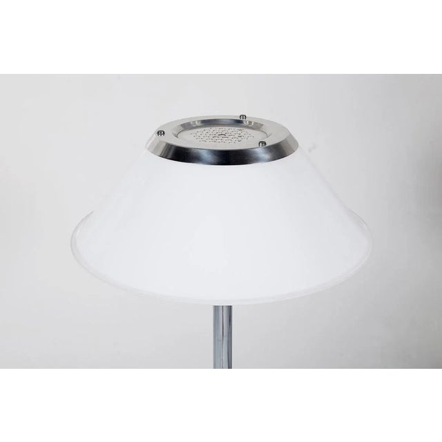 This piece has a chromed stem with a white acrylic shade. The model number is 5923. It has a label and the plaquet is...