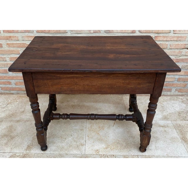 Beautiful Side Table in Oak of the 40’s. It has a long drawer with iron drawer handle and oak wood stretcher.