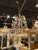 The product is an early 20th century Italian beaded crystal chandelier, likely featuring intricate designs and...