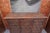 Measures 60" wide x 45 3/4" tall x 21 3/8" deep. A godsend for storage, very fine woodwork in a wonderful cross motif...