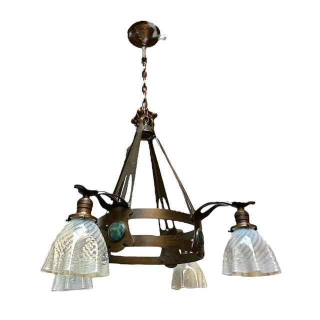 This is an absolutely beautiful and very refined fixture! The craftsmanship with the tiffany influenced fixture,...