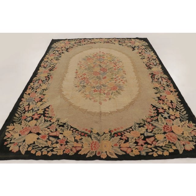 Handmade in wool, circa 1920–1929, this 9x12 antique hooked rug is a distinguished addition to Rug & Kilim’s Antique...