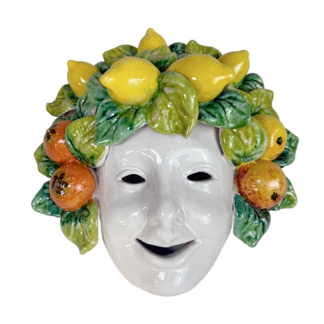 This is a whimsical vintage Italian ceramic wall mask sculpture adorned with hand-modeled lemons, citrus fruits, and...