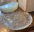 This elegant set of 12 snack plates and 12 cups features the “Sunburst“ pattern radiating from the center. The clear...