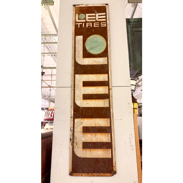 Reclaimed double sided movie set sign made of steel in brown, white, and blue. The sign reads "LEE TIRES". This was made...